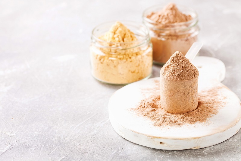 cream colored protein powder in glass containers to curb hunger
