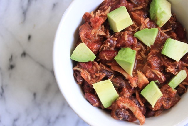 slow cooker shredded chicken chili dish with avocados