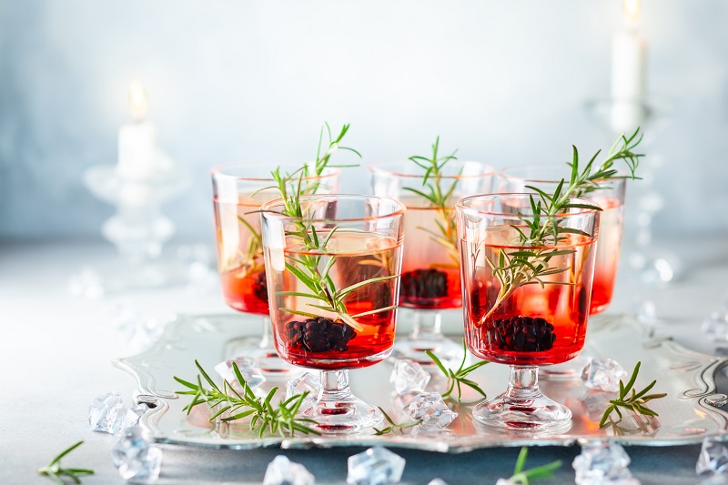 holiday drinks displayed on a silver tray. 