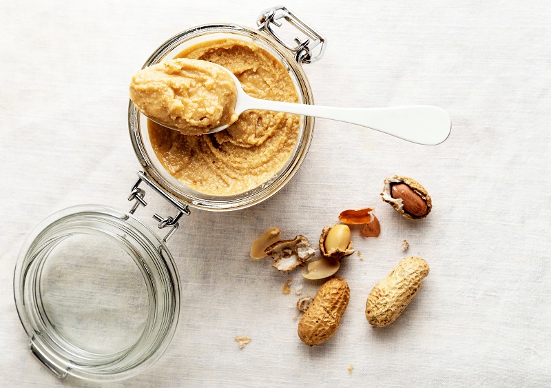peanut butter in a glass mason jar. healthy snack ideas