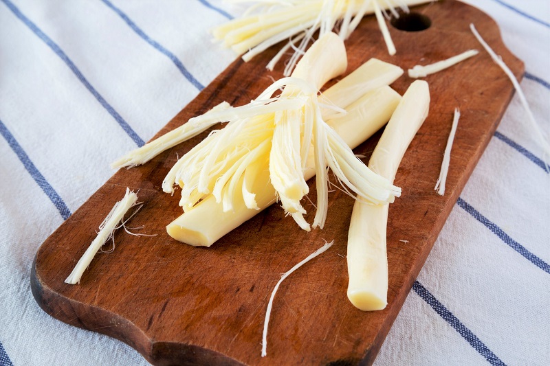 mozzarella cheese on a wooden cutting board