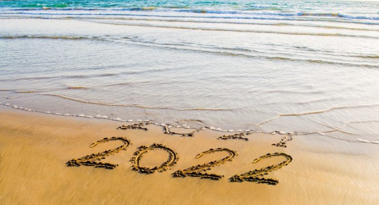 happy new year 2022 text on the sea beach.